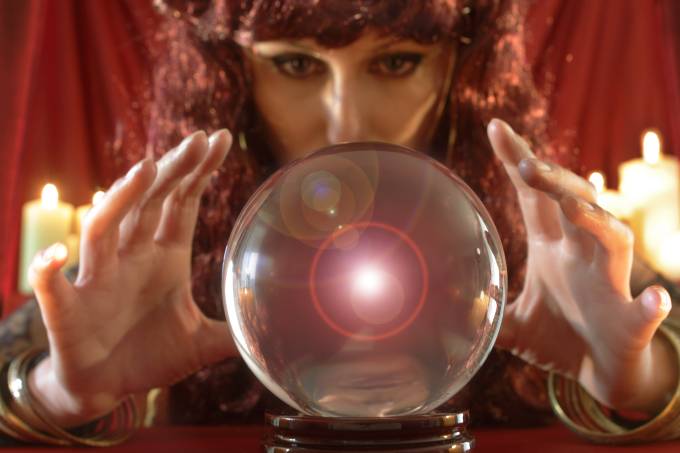Fortune teller looking into crystal ball