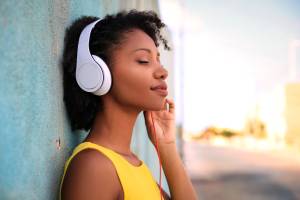 Pretty girl listening music with her headphones
